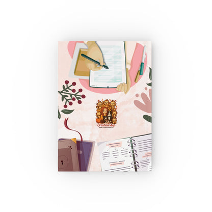 Bullet journal notitieboek met cozy design, Creatieve Aap Collectie 2025 – voorkant met schrijvend hand en open planner

Bullet journal notitieboek met cozy design, Creatieve Aap Collectie 2025 – voorkant met stoel, boeken en koffietafe