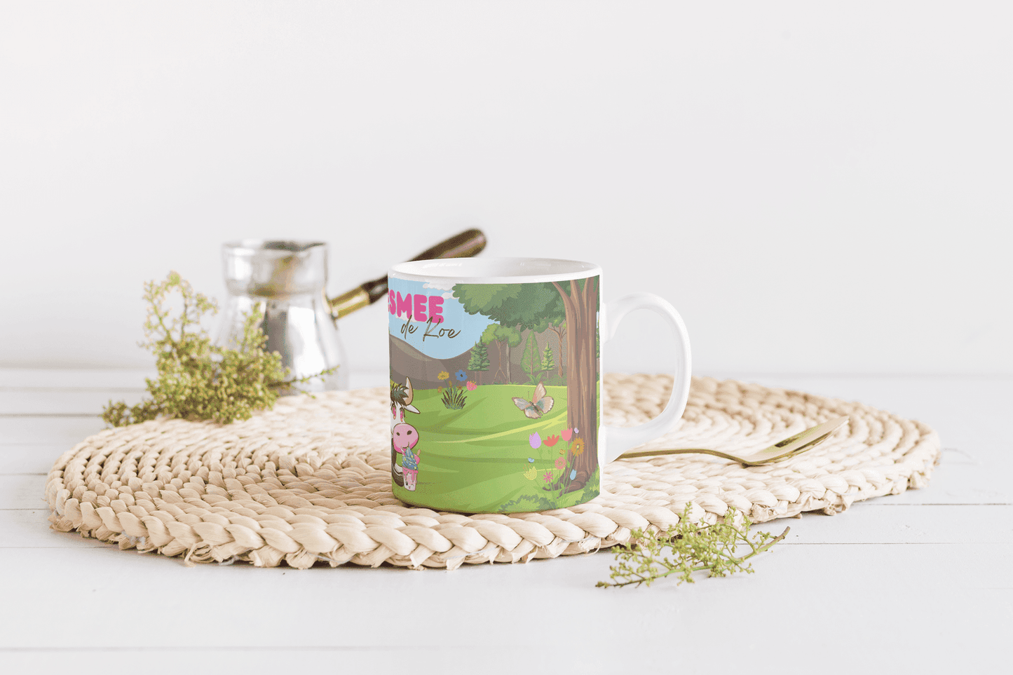 a table with a cup of coffee and a plant 